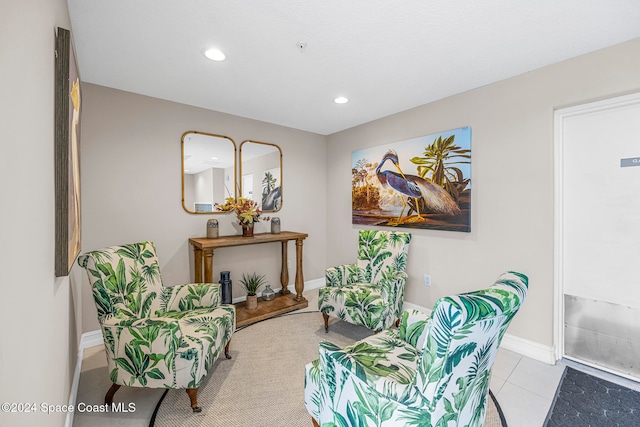 living area featuring light tile patterned floors