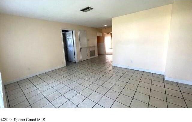 361 Payne Ave, Cocoa, FL 32927 - unfurnished room with baseboards and light tile patterned flooring