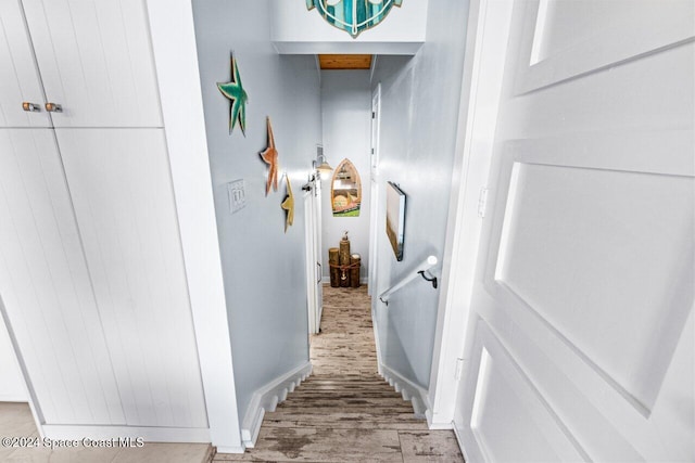 corridor featuring hardwood / wood-style floors