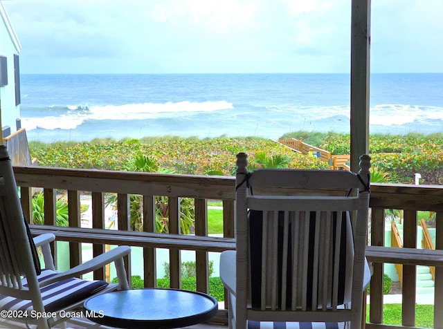 balcony featuring a water view