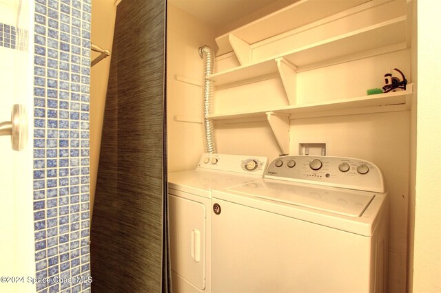 laundry area with independent washer and dryer