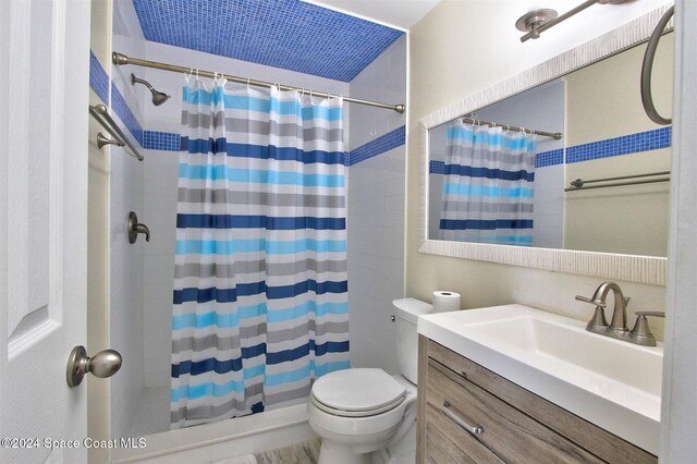 bathroom with vanity, toilet, and walk in shower