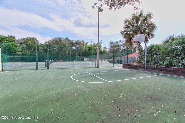 view of basketball court featuring tennis court