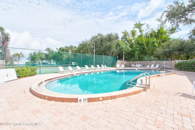 view of swimming pool featuring a patio area