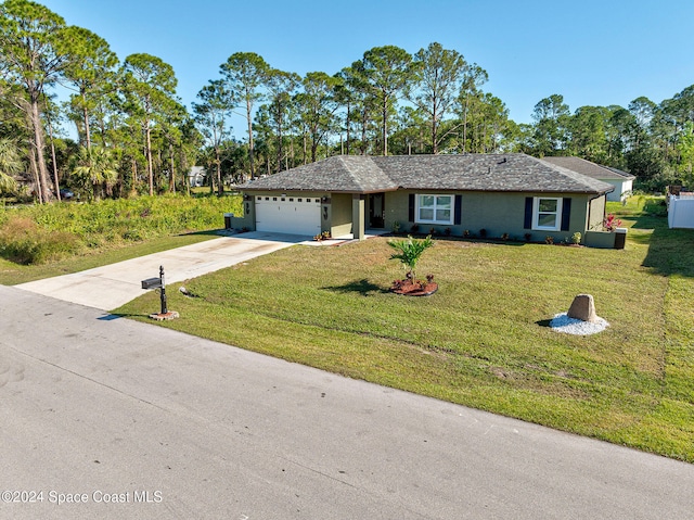 ranch-style home with concrete driveway, an attached garage, and a front yard