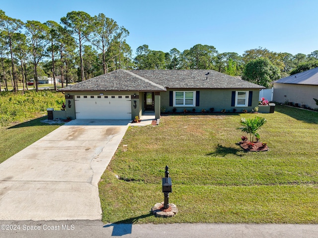 single story home featuring a front yard and a garage