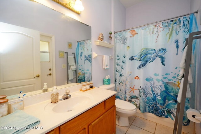 bathroom with tile patterned flooring, vanity, a shower with shower curtain, and toilet