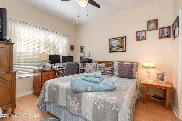 bedroom featuring light wood-type flooring and ceiling fan