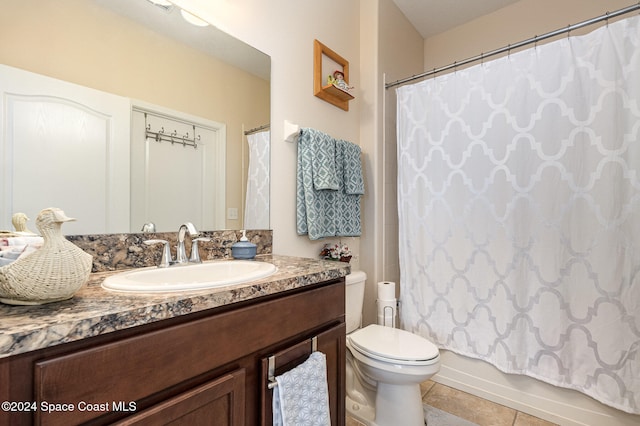 full bathroom featuring tile patterned floors, vanity, toilet, and shower / bath combo with shower curtain