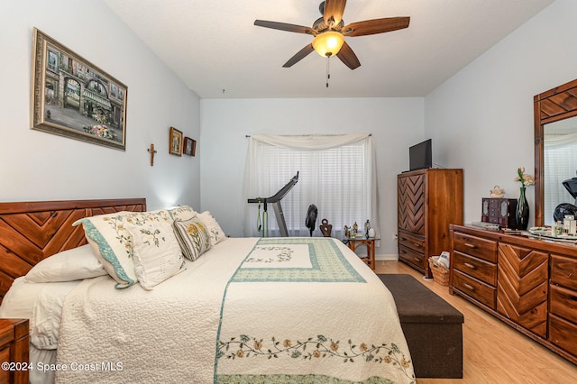 bedroom featuring ceiling fan and light hardwood / wood-style floors