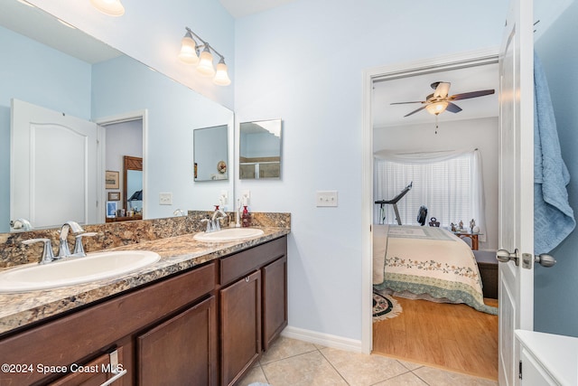 bathroom featuring tile patterned floors, ceiling fan, and vanity