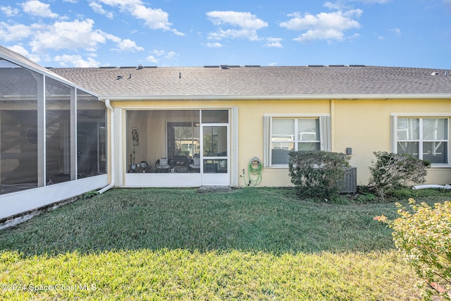 back of house featuring a yard and a lanai