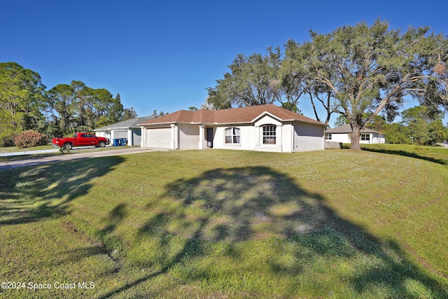 ranch-style home with a front yard and a garage