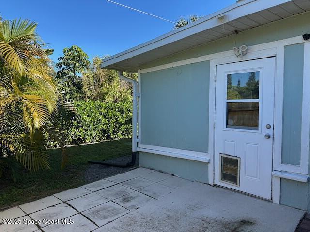 doorway to property featuring a patio area