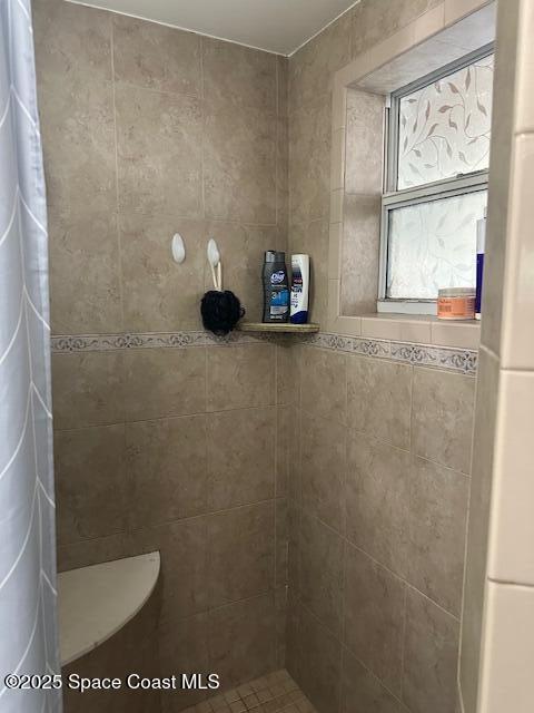 bathroom with a shower with shower curtain