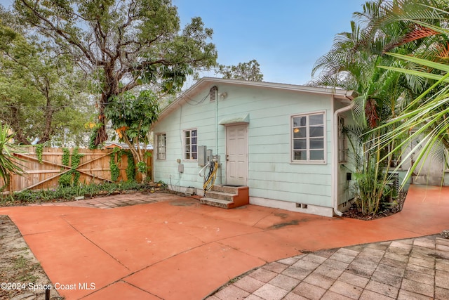 rear view of property featuring a patio area