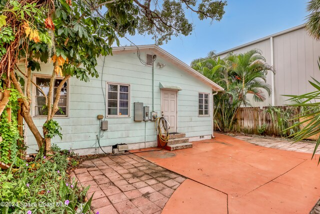 rear view of property featuring a patio area