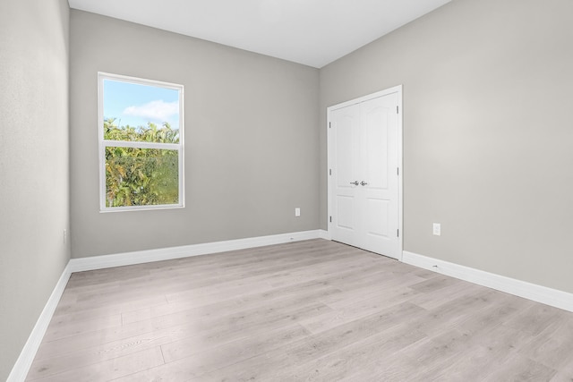 spare room with light hardwood / wood-style floors