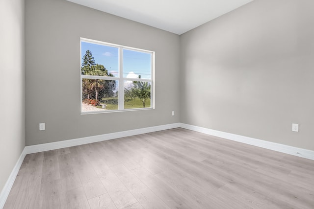 spare room featuring light hardwood / wood-style flooring