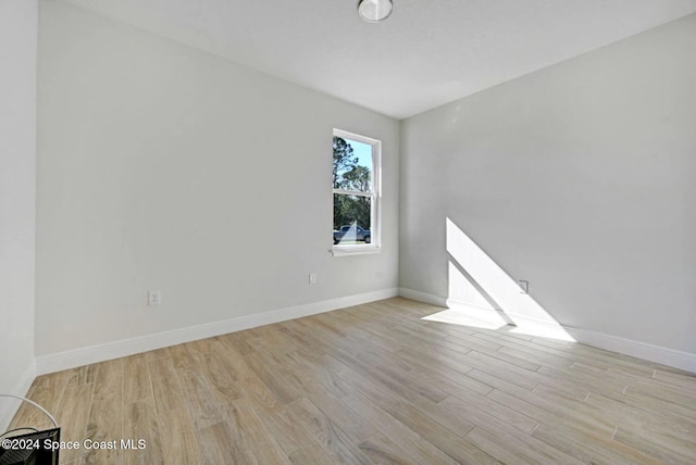 unfurnished room featuring light hardwood / wood-style flooring