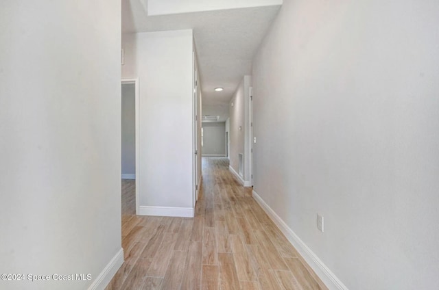 hallway featuring light hardwood / wood-style flooring