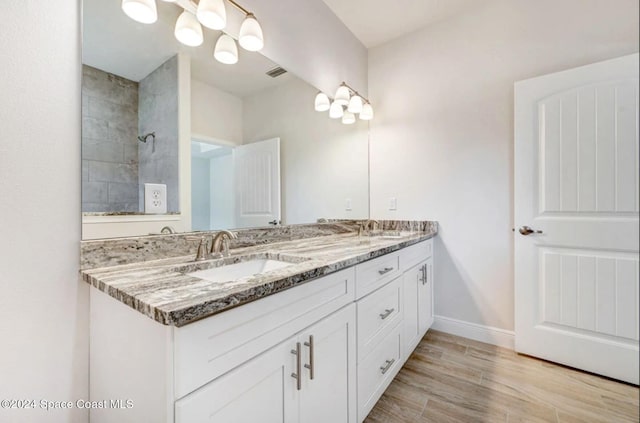 bathroom featuring hardwood / wood-style floors and vanity