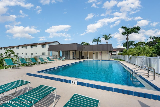 view of pool featuring a patio