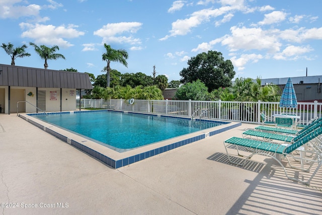 641 Ridge Club Dr Unit 21, Melbourne, FL 32934 - community pool featuring a patio