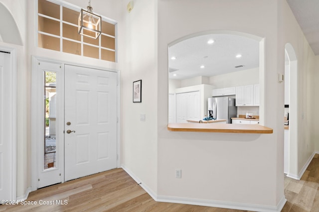 foyer with light hardwood / wood-style floors