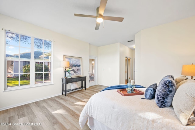 bedroom featuring light wood-type flooring and ceiling fan