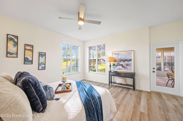 bedroom with ceiling fan and light hardwood / wood-style flooring