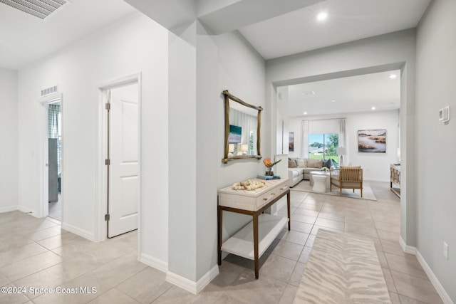 hallway with light tile patterned flooring