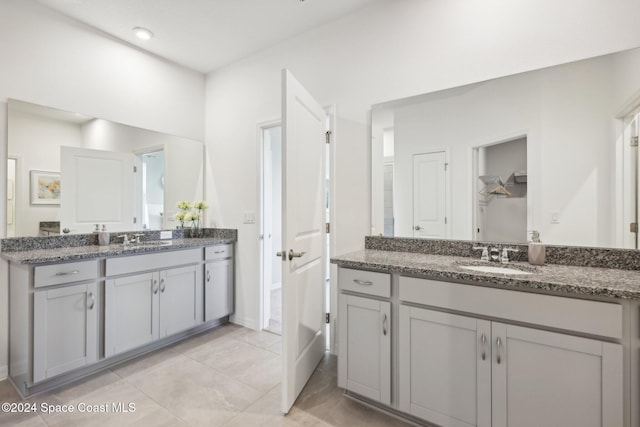 bathroom with tile patterned flooring and vanity