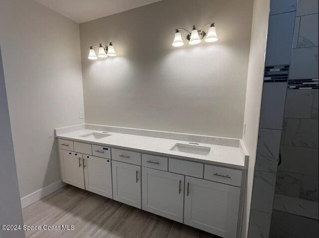 bathroom featuring hardwood / wood-style flooring and vanity