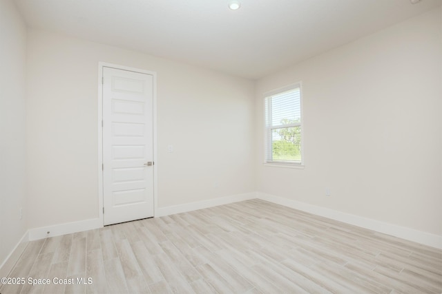 spare room with light wood-type flooring