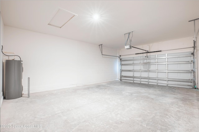 garage featuring a garage door opener and electric water heater