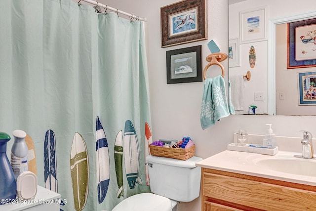 bathroom featuring vanity and toilet