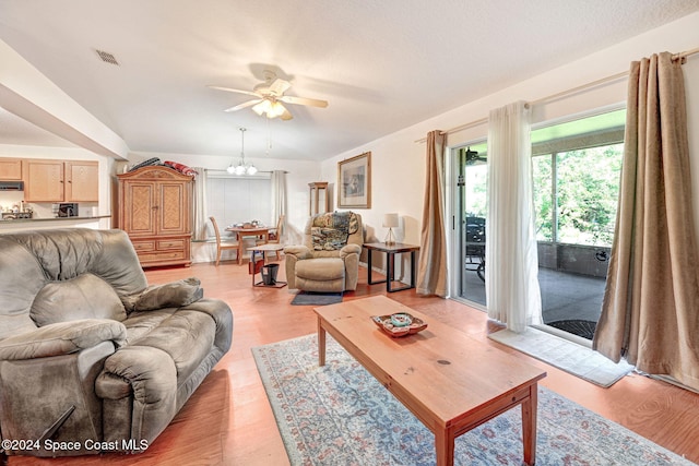 living room featuring light wood-type flooring and ceiling fan