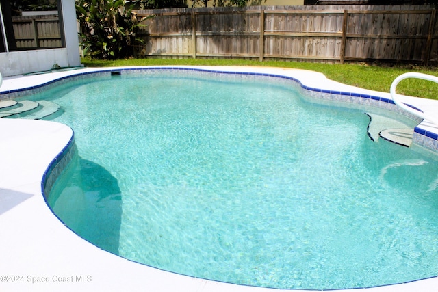 view of pool with fence and a fenced in pool