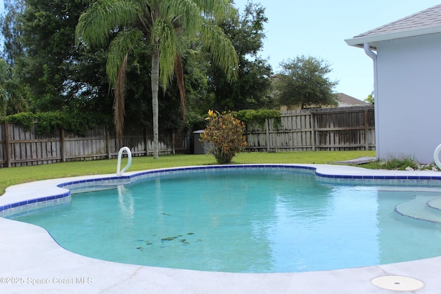 view of pool featuring a yard, a fenced backyard, and a fenced in pool