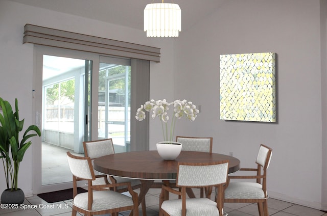 dining room featuring an inviting chandelier and light tile patterned floors