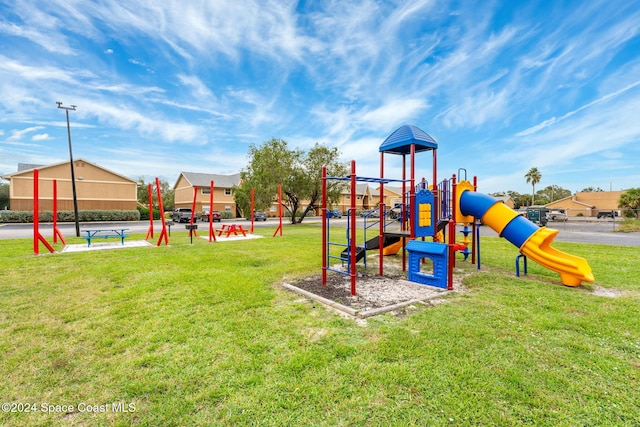 view of playground with a yard