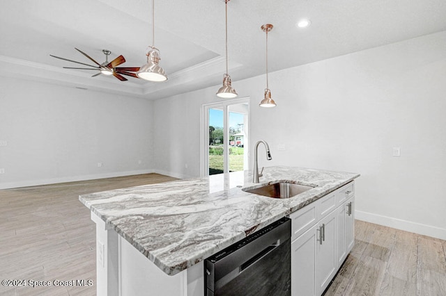 kitchen with sink, white cabinetry, a center island with sink, a raised ceiling, and dishwasher