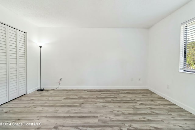 empty room with light wood-type flooring