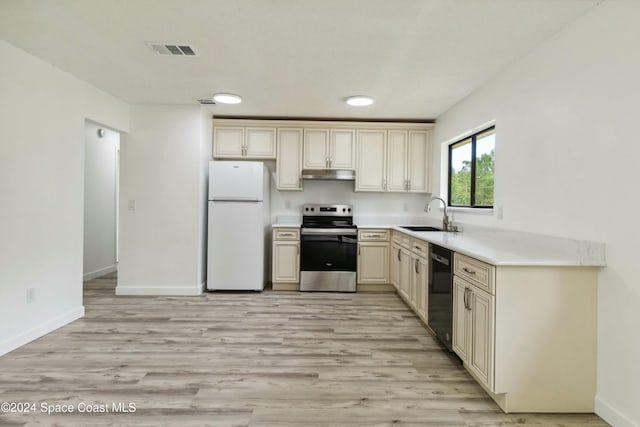 kitchen featuring dishwasher, sink, electric range, light hardwood / wood-style floors, and white fridge