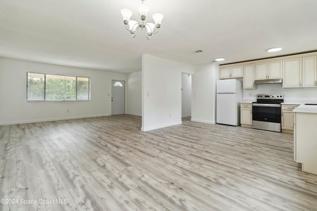 kitchen with light hardwood / wood-style flooring, a notable chandelier, cream cabinets, white fridge, and stainless steel range with electric stovetop