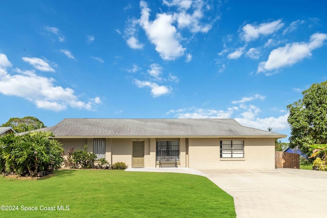 ranch-style house with a front yard