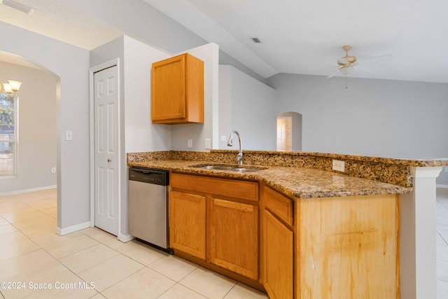 kitchen featuring dishwasher, sink, vaulted ceiling, light tile patterned floors, and ceiling fan with notable chandelier