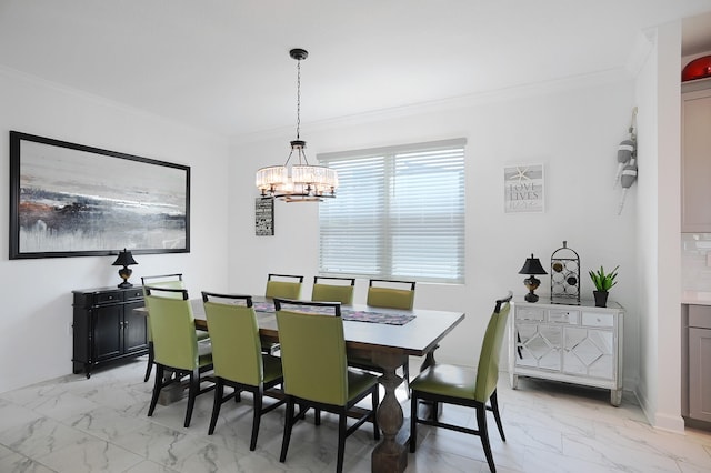 dining area featuring a chandelier and ornamental molding