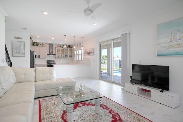 living room featuring ceiling fan